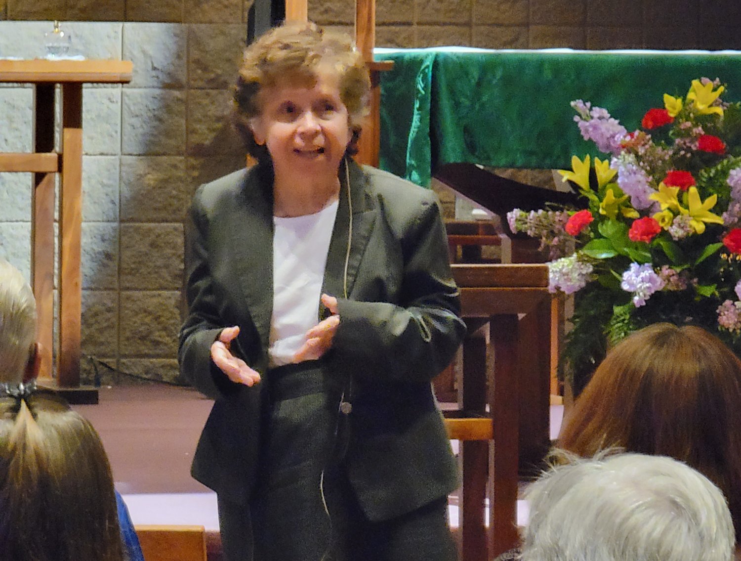 Marie Kenyon, director of the Office of Peace and Justice of the St. Louis archdiocese, gives a presentation on Catholic social teaching as the inaugural speaker for the Martha Trauth Social Justice Education Endowment’s annual speaker series on Sept. 15 in the St. Thomas More Newman Center Chapel in Columbia.